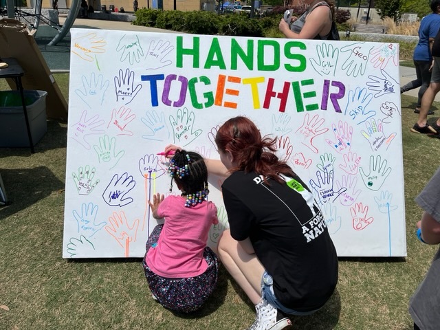 "hands together" board with hand prints